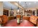 Open kitchen with an island, dark wood cabinets, and pendant lighting at 35140 N 52Nd Pl, Cave Creek, AZ 85331
