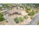 Aerial view showcasing a luxurious house with a pool and circular driveway at 35140 N 52Nd Pl, Cave Creek, AZ 85331