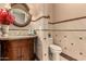 Powder room with decorative tile, granite vanity, and a pedestal sink at 35140 N 52Nd Pl, Cave Creek, AZ 85331