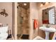 Bathroom with a shower stall, pedestal sink, and decorative mirror at 35140 N 52Nd Pl, Cave Creek, AZ 85331