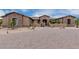 Stone house with a large front yard and gated entry at 35140 N 52Nd Pl, Cave Creek, AZ 85331