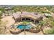 Aerial view of house with a kidney shaped pool and expansive backyard at 35140 N 52Nd Pl, Cave Creek, AZ 85331