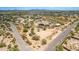 Aerial view showing a home on acreage with stables at 35140 N 52Nd Pl, Cave Creek, AZ 85331