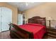 Spacious bedroom with a large bed, built-in shelving, and hardwood floors at 35140 N 52Nd Pl, Cave Creek, AZ 85331