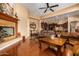 Living area with hardwood floors, a fireplace, and views of the kitchen at 35140 N 52Nd Pl, Cave Creek, AZ 85331