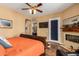 Bright bedroom with a king-size bed, fireplace, and hardwood floors at 35140 N 52Nd Pl, Cave Creek, AZ 85331