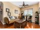 Cozy sitting area with a comfortable sofa, coffee table, and hardwood floors at 35140 N 52Nd Pl, Cave Creek, AZ 85331