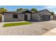 Modern home with gray brick exterior and paver driveway at 1521 E Pinchot Ave, Phoenix, AZ 85014