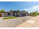 Modern home with gray brick exterior and paver driveway at 1521 E Pinchot Ave, Phoenix, AZ 85014