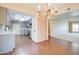 Bright dining room with hardwood floors and a chandelier at 292 Leisure World --, Mesa, AZ 85206