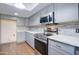 Stainless steel appliances and gray cabinets in this updated kitchen at 292 Leisure World --, Mesa, AZ 85206