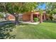 Home exterior showcasing a covered entryway and lawn at 292 Leisure World --, Mesa, AZ 85206