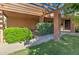 Covered patio with brick columns and lush greenery at 292 Leisure World --, Mesa, AZ 85206