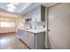 Gray kitchen cabinets, quartz countertops, and a modern sink and faucet at 292 Leisure World --, Mesa, AZ 85206