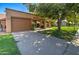 Attractive exterior with a brown garage door and landscaping at 292 Leisure World --, Mesa, AZ 85206