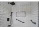 Modern shower with white subway tile and black fixtures at 292 Leisure World --, Mesa, AZ 85206