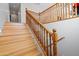 Elegant wooden staircase with detailed railing and banister at 5116 W Trotter Trl, Phoenix, AZ 85083