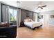 Bright bedroom with wood floors and access to a private balcony at 5116 W Trotter Trl, Phoenix, AZ 85083