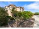 Beautiful two-story home with a well-manicured front yard and landscaping at 5116 W Trotter Trl, Phoenix, AZ 85083