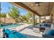 Inviting backyard oasis with sparkling pool and patio furniture at 5116 W Trotter Trl, Phoenix, AZ 85083