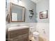 Stylish powder room with modern vanity and decorative accents at 5116 W Trotter Trl, Phoenix, AZ 85083