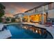 Inviting pool and patio area with seating and lighting at 5116 W Trotter Trl, Phoenix, AZ 85083