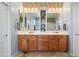 Double vanity bathroom with updated cabinetry and tile at 5116 W Trotter Trl, Phoenix, AZ 85083