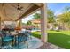 Relaxing patio area with dining table and view of the pool at 5116 W Trotter Trl, Phoenix, AZ 85083