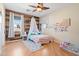 Charming bedroom with wood-like accent wall and a comfy bed at 5116 W Trotter Trl, Phoenix, AZ 85083