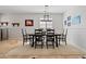 Formal dining room with a rustic wooden table and neutral decor at 5116 W Trotter Trl, Phoenix, AZ 85083