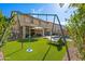 Landscaped backyard with a pool, patio, and playset at 5116 W Trotter Trl, Phoenix, AZ 85083