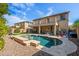 Spacious backyard oasis with a sparkling pool and patio at 5116 W Trotter Trl, Phoenix, AZ 85083