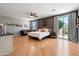 Spacious primary bedroom with wood floors and private balcony access at 5116 W Trotter Trl, Phoenix, AZ 85083