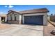 Front view of the house showcasing a grey garage door at 19741 E Reins Rd, Queen Creek, AZ 85142
