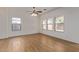 Bright dining room with wood-look tile floors and large windows at 19741 E Reins Rd, Queen Creek, AZ 85142