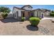 House exterior with stone accents and desert landscaping at 19741 E Reins Rd, Queen Creek, AZ 85142