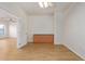 Bright bonus room with wood-look tile floors and built-in cabinetry at 19741 E Reins Rd, Queen Creek, AZ 85142