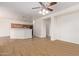 Open kitchen with island and stainless steel appliances at 19741 E Reins Rd, Queen Creek, AZ 85142
