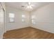 Bedroom with ceiling fan and wood flooring at 19741 E Reins Rd, Queen Creek, AZ 85142