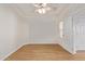 Spacious bedroom featuring wood-look tile floors and a ceiling fan at 19741 E Reins Rd, Queen Creek, AZ 85142