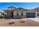One-story home with a two-car garage and attractive landscaping at 19741 E Reins Rd, Queen Creek, AZ 85142