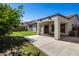 Covered patio and grassy backyard at 19741 E Reins Rd, Queen Creek, AZ 85142