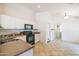 Well-equipped kitchen with white cabinetry and tile flooring at 17555 W Dalea Dr, Goodyear, AZ 85338