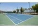 Well-maintained tennis court with surrounding landscape at 17555 W Dalea Dr, Goodyear, AZ 85338