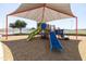playground with slides and climbing equipment under shade structure at 17555 W Dalea Dr, Goodyear, AZ 85338