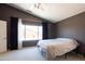 Bedroom with window, ceiling fan and carpet flooring at 17555 W Dalea Dr, Goodyear, AZ 85338