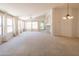 Open living room with ample natural light and backyard access at 17555 W Dalea Dr, Goodyear, AZ 85338