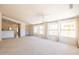 Open concept living room with views of the kitchen and backyard at 17555 W Dalea Dr, Goodyear, AZ 85338