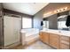Elegant bathroom with double vanity, soaking tub, and shower at 17555 W Dalea Dr, Goodyear, AZ 85338