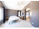 Primary bedroom with en-suite bathroom and window views at 17555 W Dalea Dr, Goodyear, AZ 85338
